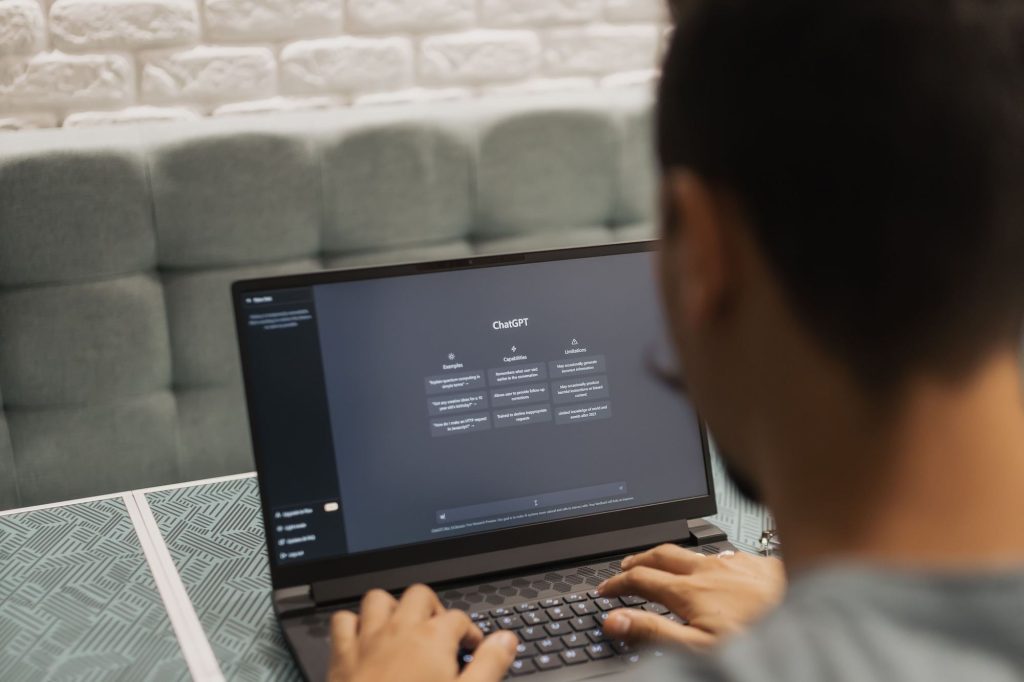 Man using an AI chatbot on his laptop