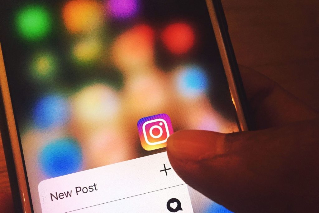 Thumb on the Instagram app, about to create a new post